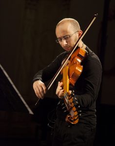 man playing viola