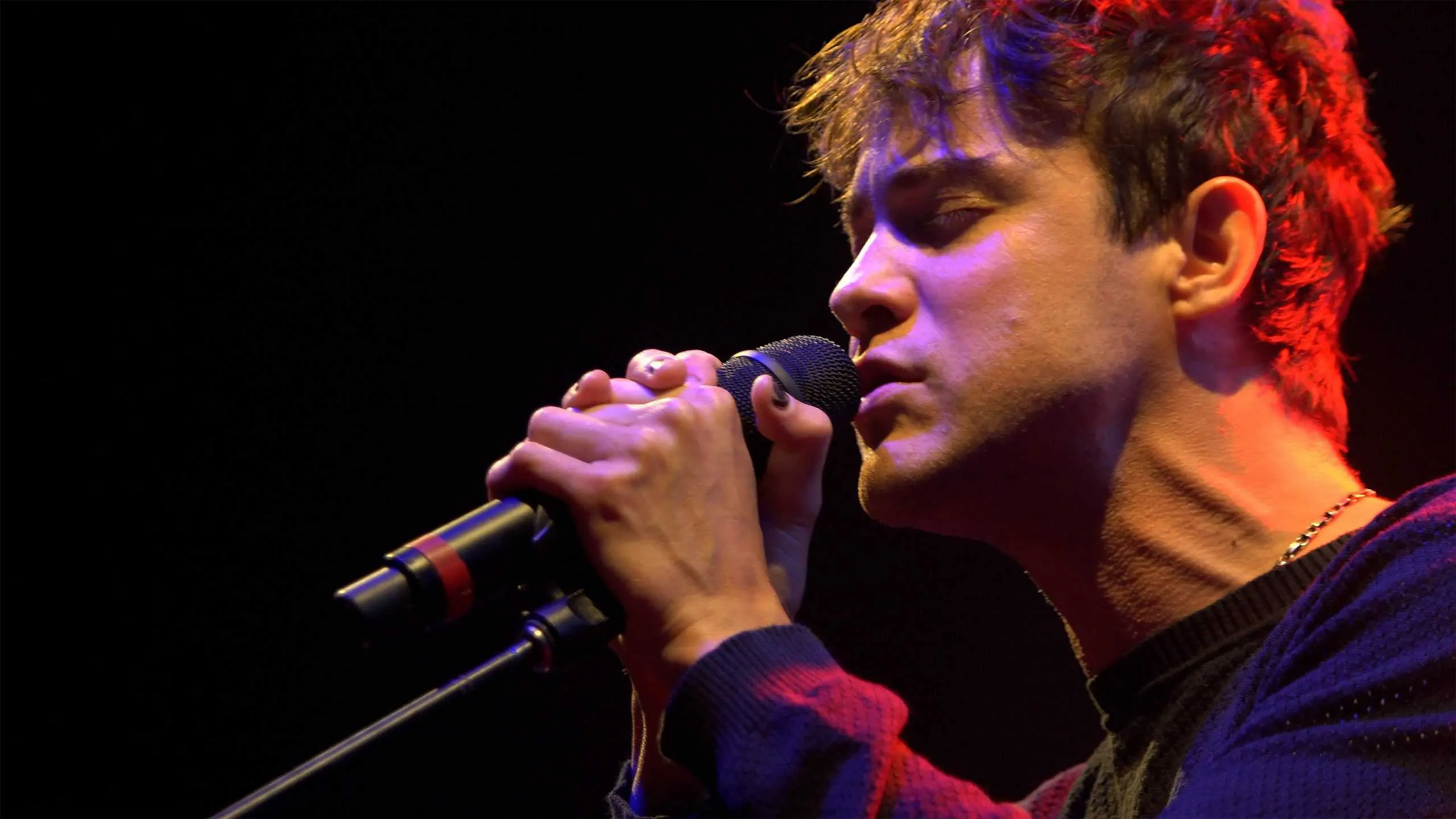 Man singing with strained neck
