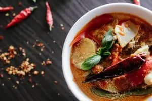 Thai curry showing the type of food not to eat if you want to avoid a common singing mistake