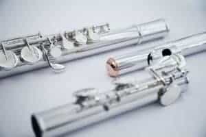 disassembled flute angled on white
