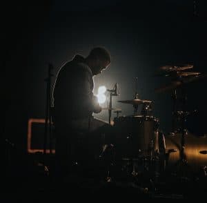 drummer on stage dark lighting