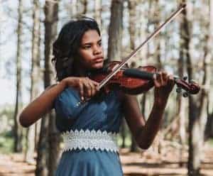 girl playing the viola outside