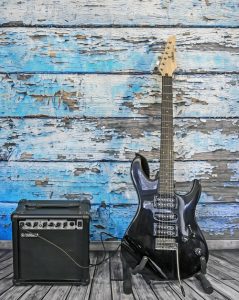 Guitar and poor quality amp showcasing the common mistake of buying poor quality gear