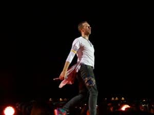 Chris Martin on stage looking relaxed