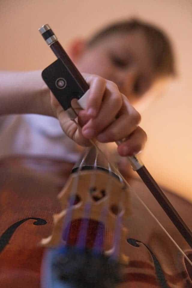kid playing cello