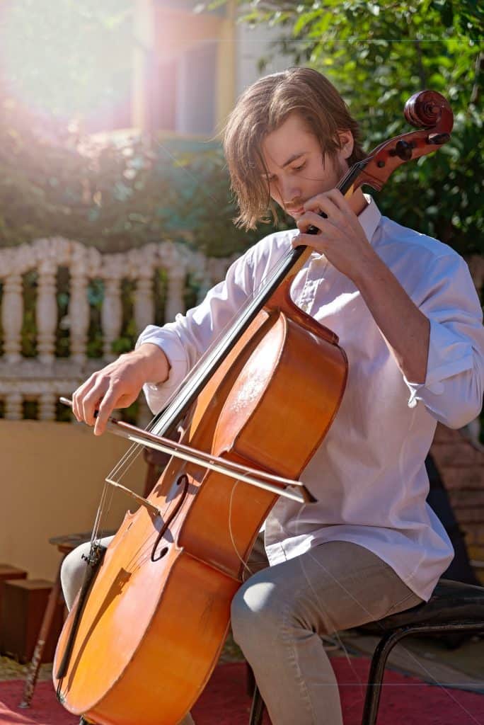 man practising cello