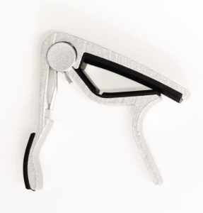Spring-loaded capo for guitar