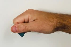 Fist method of holding a pick for guitar