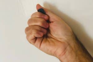 Fist method of holding a pick for guitar - underside view