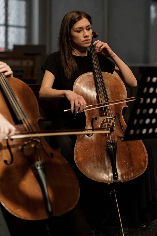 two cellos playing together