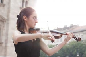 Violinist playing outside