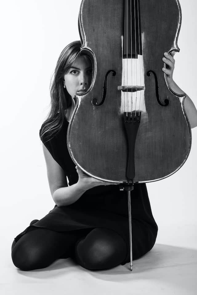 woman holding cello body